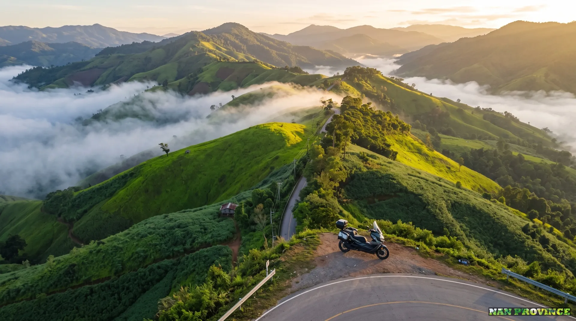 Winding mountain highway through lush green hills on the road trip from Chiang Mai to Nan